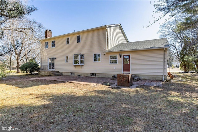 back of property featuring a chimney