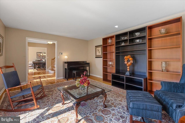 living room with baseboards and wood finished floors