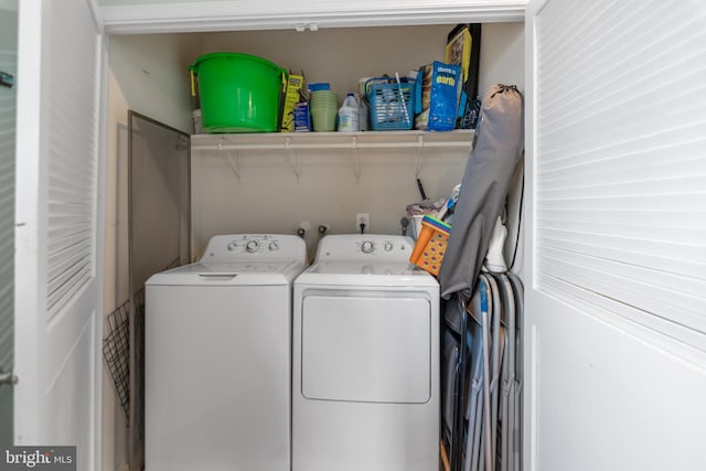 laundry room featuring laundry area and washing machine and clothes dryer