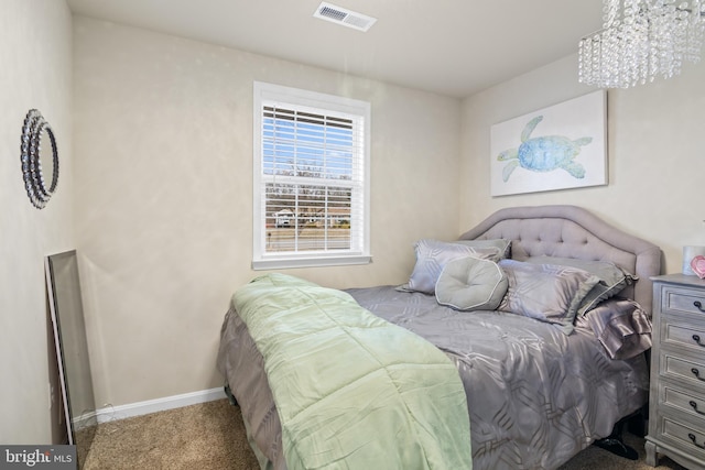 bedroom featuring visible vents, baseboards, and carpet flooring