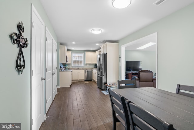 dining area featuring recessed lighting, visible vents, and dark wood-style flooring