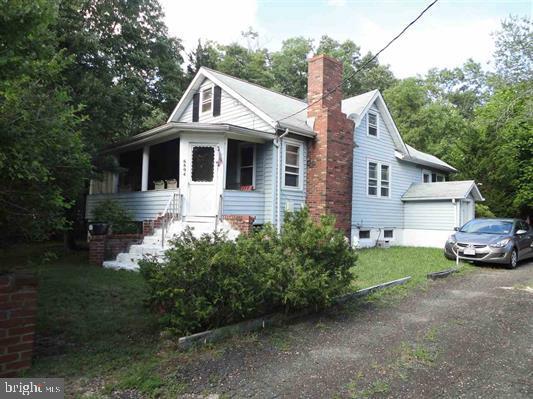 bungalow-style house featuring a front yard