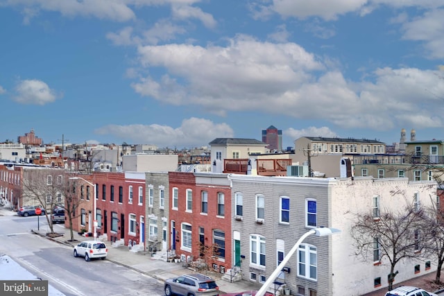 exterior space with central AC unit and a city view