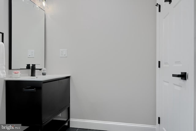 bathroom with vanity and baseboards