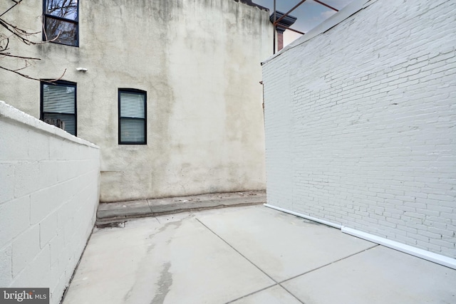 property entrance featuring a patio area and fence