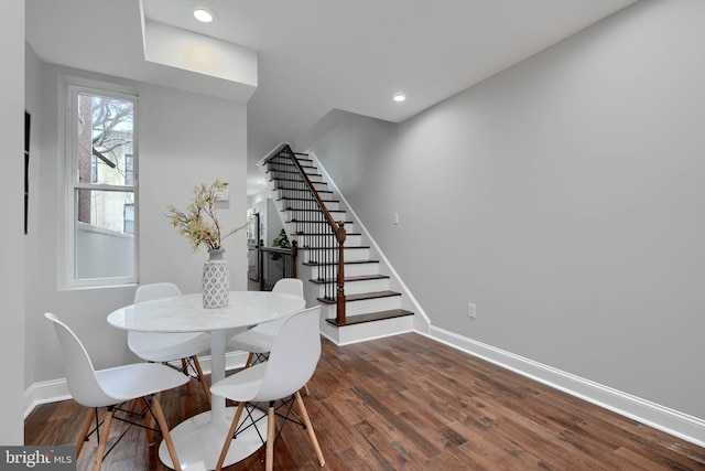 dining space with dark wood-style flooring, stairway, recessed lighting, and baseboards