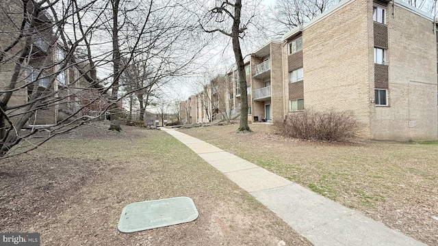 surrounding community featuring a lawn