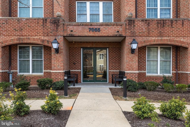 view of exterior entry featuring french doors