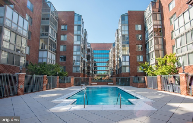 view of pool with fence