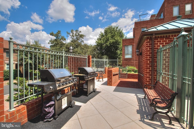 view of patio with fence and grilling area