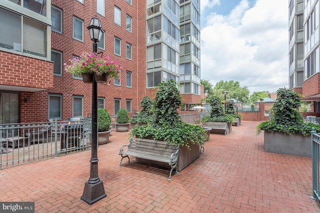 view of property's community featuring fence