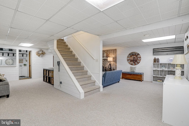 finished basement with carpet floors and stairway