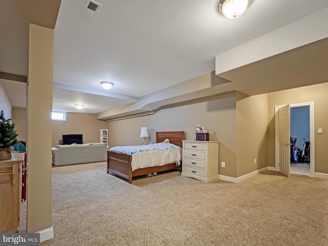 bedroom featuring light colored carpet, visible vents, and baseboards