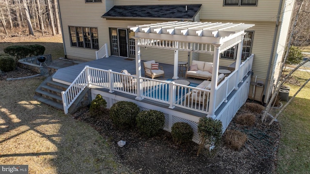 deck with outdoor lounge area and a pergola