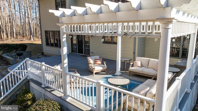 deck featuring an outdoor pool, an outdoor hangout area, and a pergola