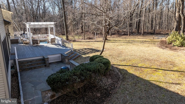 view of yard with a deck and a pergola