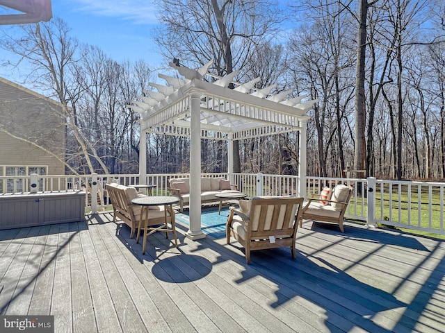 wooden terrace featuring an outdoor hangout area and a pergola