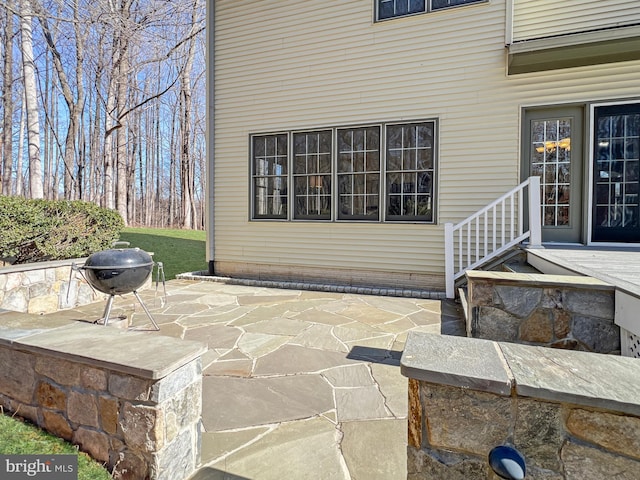 view of patio with a grill