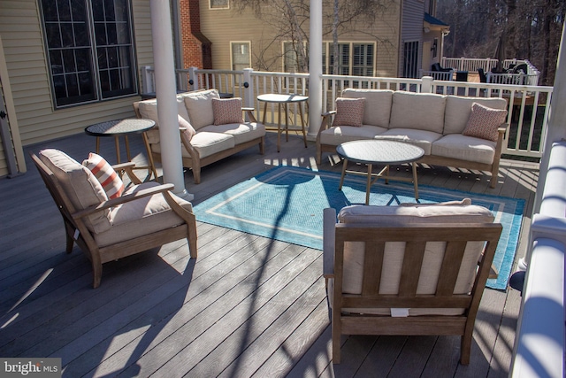 deck with an outdoor hangout area