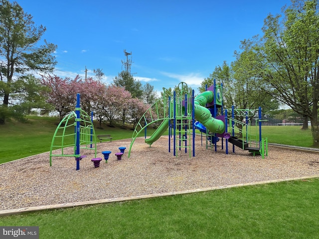 community jungle gym with a lawn