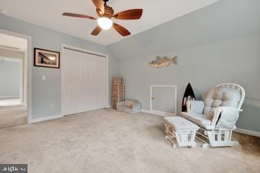 unfurnished room featuring lofted ceiling, ceiling fan, carpet floors, and baseboards