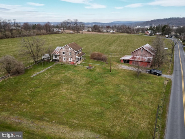 birds eye view of property with a rural view