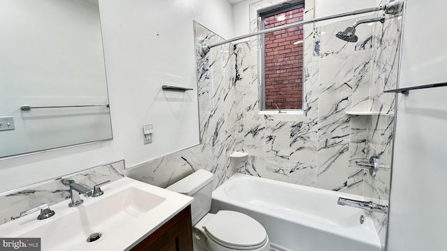 full bathroom with toilet, vanity, and tiled shower / bath combo