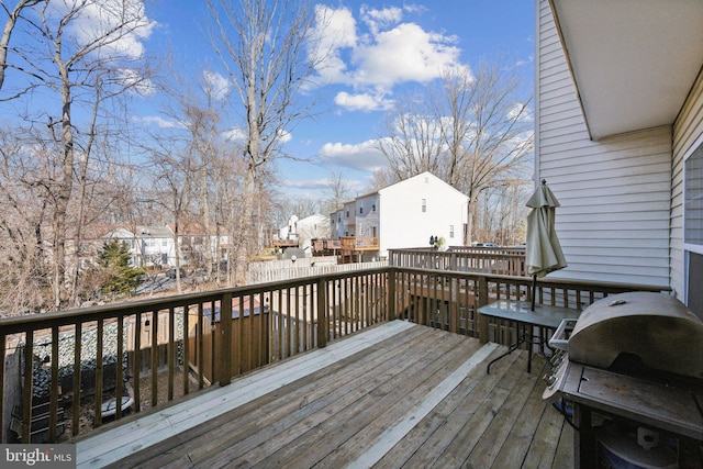 deck featuring a residential view and grilling area