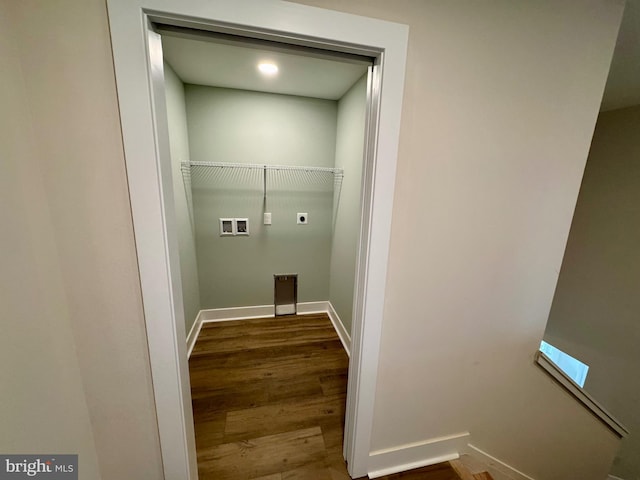 washroom with baseboards, dark wood-style floors, hookup for a washing machine, and electric dryer hookup
