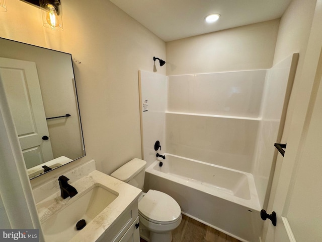 bathroom featuring shower / tub combination, wood finished floors, toilet, and vanity