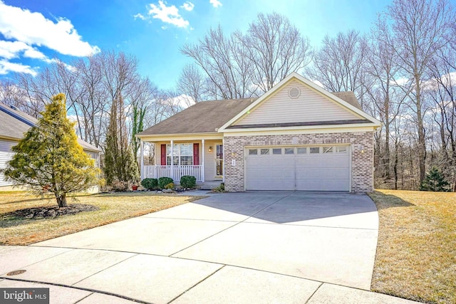 view of front of home with a front yard, a garage, and a porch