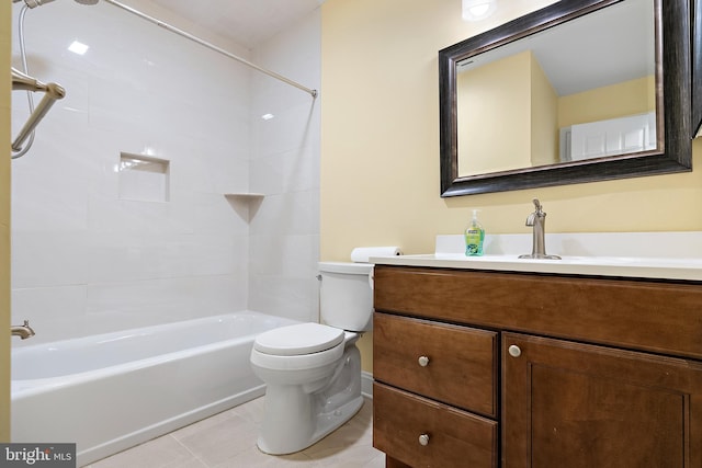 full bathroom featuring tile patterned floors, toilet, vanity, and tiled shower / bath combo