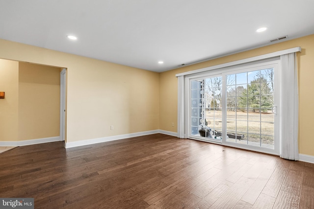 unfurnished living room featuring dark wood-type flooring