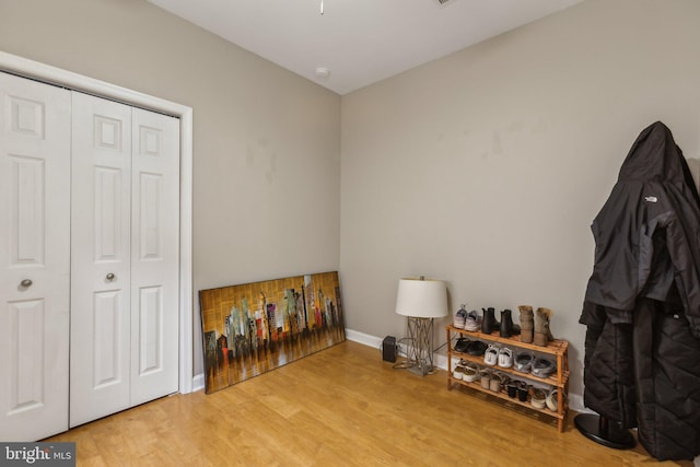 miscellaneous room with light wood-type flooring and baseboards