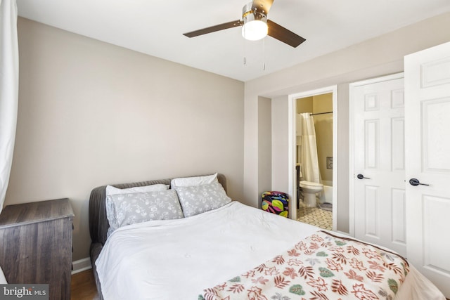 bedroom featuring a ceiling fan and ensuite bathroom