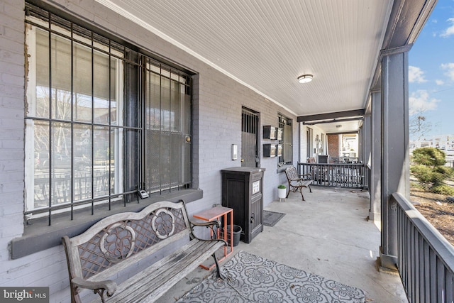 view of patio featuring a porch