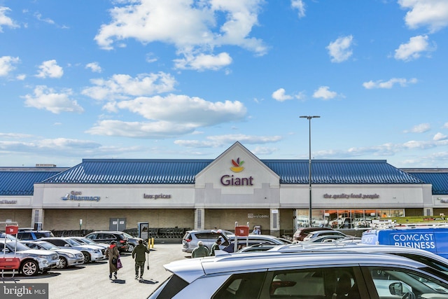 view of building exterior featuring uncovered parking