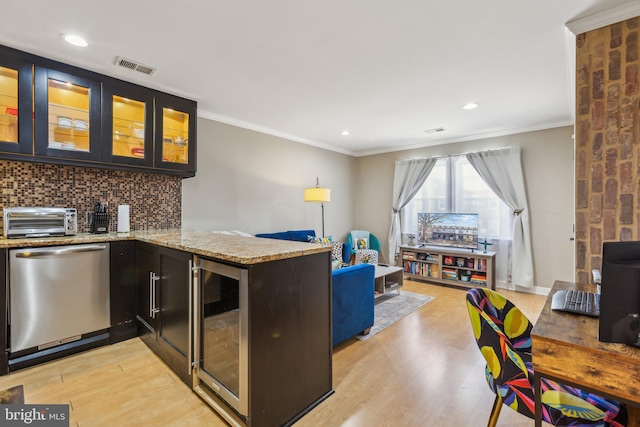 kitchen with a peninsula, wine cooler, glass insert cabinets, and dishwasher