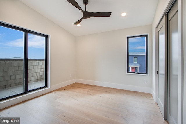 empty room featuring a ceiling fan, light wood-type flooring, baseboards, and recessed lighting