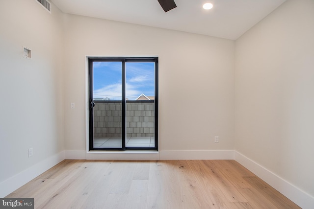 unfurnished room featuring recessed lighting, visible vents, baseboards, and wood finished floors