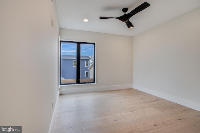 spare room with recessed lighting, ceiling fan, baseboards, and wood finished floors