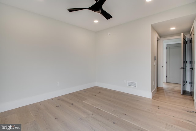 spare room with visible vents, baseboards, a ceiling fan, light wood-style flooring, and recessed lighting