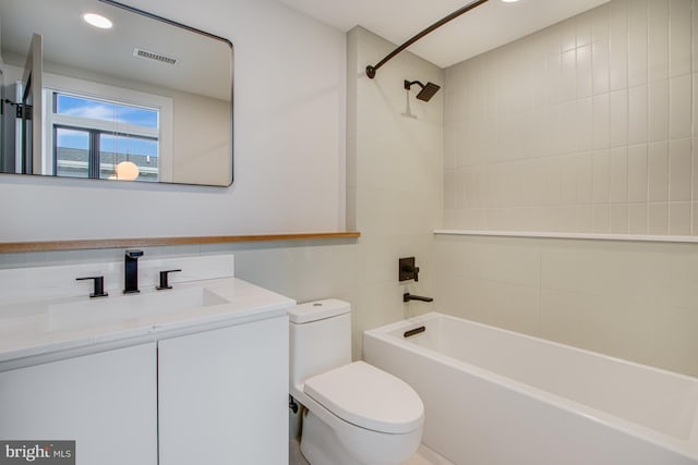 bathroom featuring visible vents, toilet, tub / shower combination, vanity, and recessed lighting