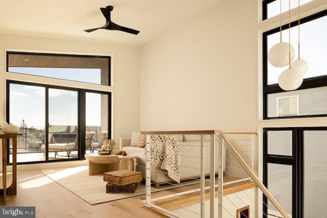 interior space with a towering ceiling and wood finished floors