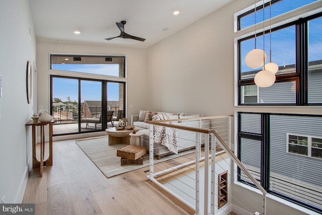 bedroom with hardwood / wood-style flooring, access to outside, baseboards, and recessed lighting