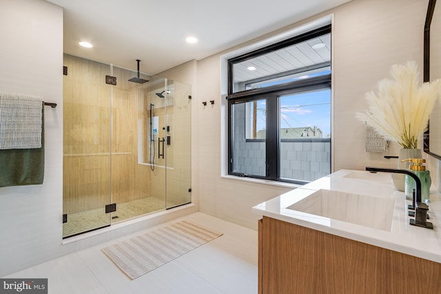 full bath with a stall shower, tile patterned flooring, vanity, and recessed lighting