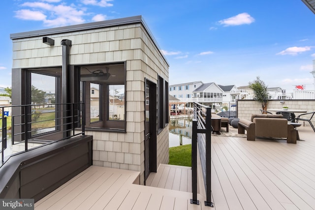 wooden deck featuring a residential view