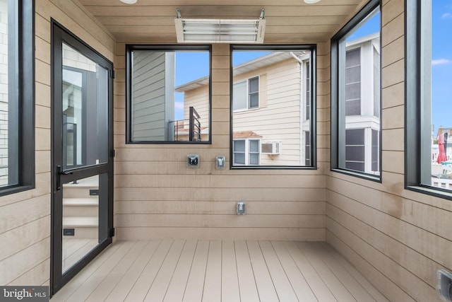 unfurnished sunroom featuring wooden ceiling