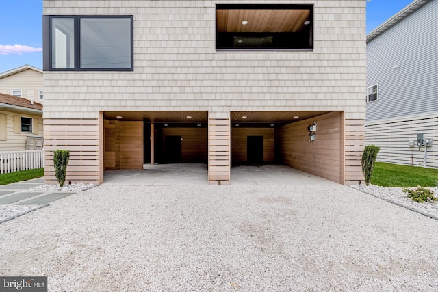 view of front of property with a carport and driveway