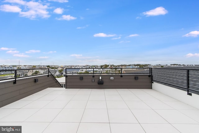 view of patio featuring a balcony